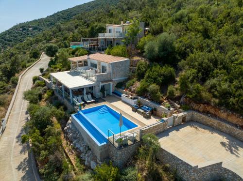 an aerial view of a house with a swimming pool at Alfresco Villas in Sivota