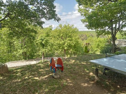 a ping pong table and a ping pong table at Gîte de Cayssie in Verrières