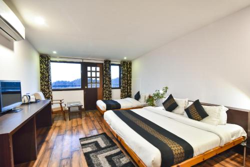 Una cama o camas en una habitación de Hotel M AND RESORT