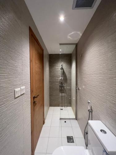 a bathroom with a shower and a sink and a toilet at Your home 2 in Jeddah