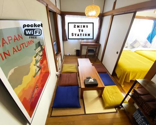 a small room with a bed and a table at Good aces to Shibuya/2mins walk sta/Max12ppl/1flor in Tokyo