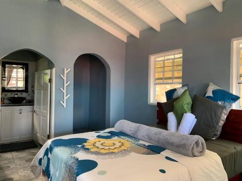a bedroom with a bed and a couch at Story Villa 1 Bedroom with Ocean & Mountain View in Canaries