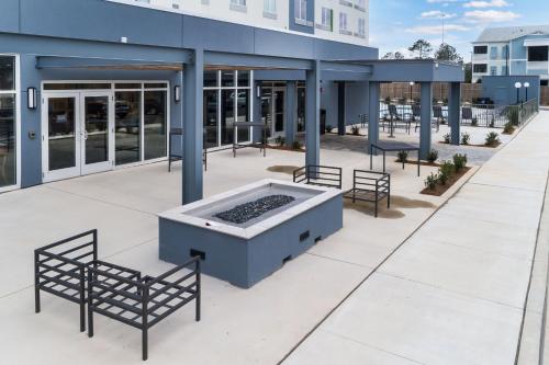 a large building with a hot tub on a patio at Courtyard by Marriott Pensacola I-10 West in Pensacola