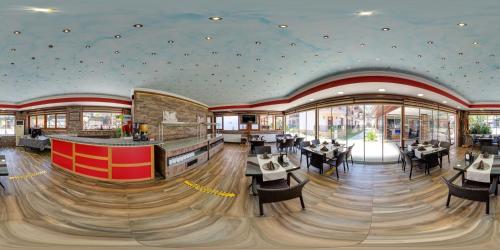 a dining room with tables and chairs in a restaurant at Street61 Apart Hotel in Sarigerme