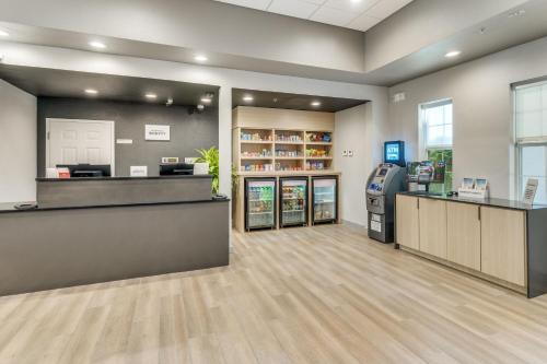 a lobby of a store with a cash counter and a cash register at TownePlace Suites Dallas Arlington North in Arlington