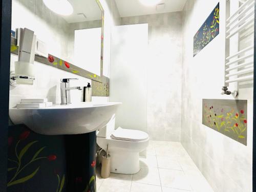 a bathroom with a sink and a toilet at Hotel Zerta Old Tbilisi in Tbilisi City