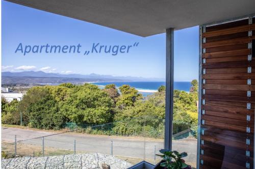 a view of the ocean from the balcony of a house at Hilltop Bayview Luxury Apartments in Plettenberg Bay