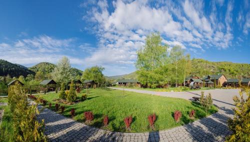 an image of a park with houses and a pathway at Рибничанка in Skhidnitsa