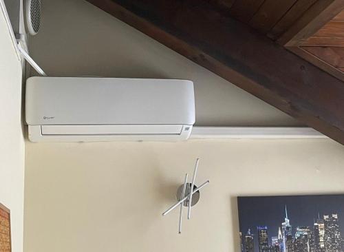 a wall mounted air conditioner on a wall at Chalet Dalì in Turin