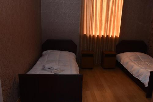 Postel nebo postele na pokoji v ubytování HOTEL SAMEGRELO