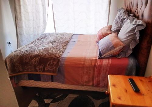 Un ou plusieurs lits dans un hébergement de l'établissement NSK GUEST HOUSE