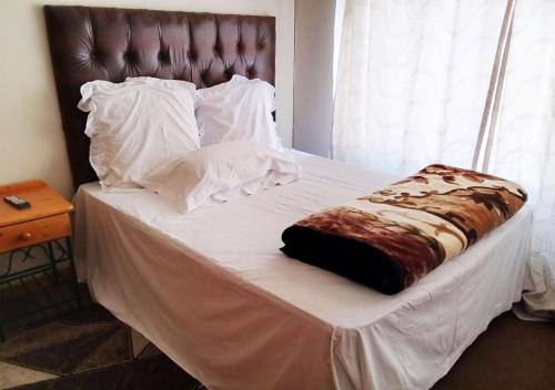 Un ou plusieurs lits dans un hébergement de l'établissement NSK GUEST HOUSE