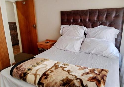Un ou plusieurs lits dans un hébergement de l'établissement NSK GUEST HOUSE