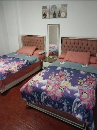 Säng eller sängar i ett rum på شقة مفروشة للايجار عباس الرئيسي