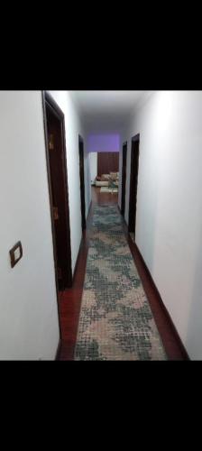 a hallway with a rug on the floor of a room at شقة مفروشة للايجار عباس الرئيسي in Cairo