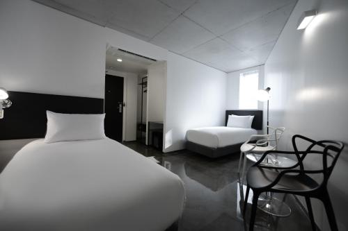 Postel nebo postele na pokoji v ubytování Creto Hotel Myeongdong