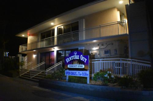 a welcome sign in front of a house at night at Pelican's Roost, Waterfront comfort at Venture Out in Cudjoe Key