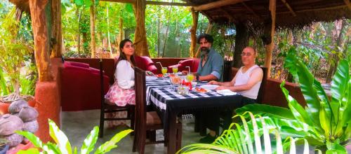 a group of people sitting at a table at Dambulla Kings Inn in Dambulla