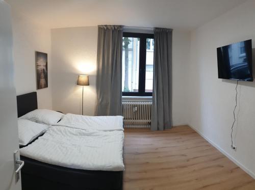 Postel nebo postele na pokoji v ubytování Studio Apartments in Ruhrgebiet