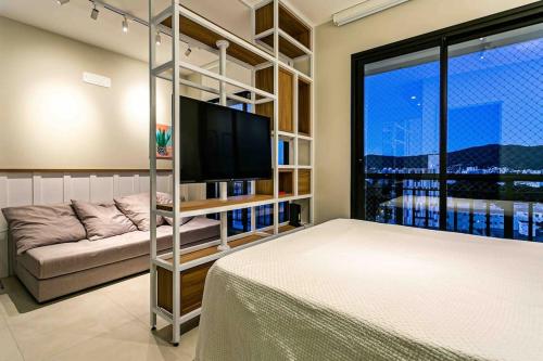 Ένα ή περισσότερα κρεβάτια σε δωμάτιο στο Design FLAT Wifi 1gb frente Ufsc