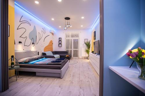 a living room with a couch and a tv at Centre point Apartment in Budapest