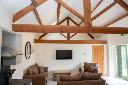 TV a/nebo společenská místnost v ubytování Stables Cottage