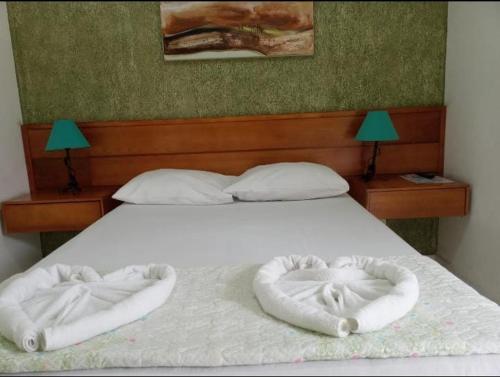 מיטה או מיטות בחדר ב-Pousada Villa Del Mare