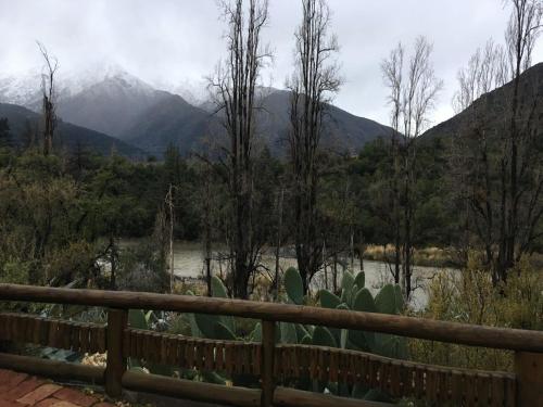 a view of a river with mountains in the background at Loft del Rio in Cajon del Maipo