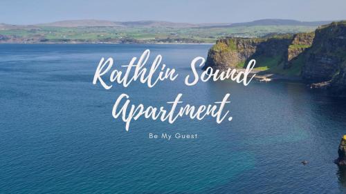 a view of a lake with mountains in the background at Rathlin Sound Apartment, Ballycastle in Ballycastle