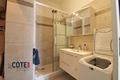 a bathroom with a shower and a sink at Le Briand in Carry-le-Rouet