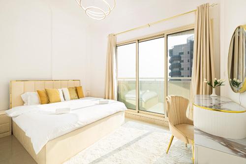 a bedroom with a bed and a large window at Luxury 1 Bedroom On Marina Walk in Dubai