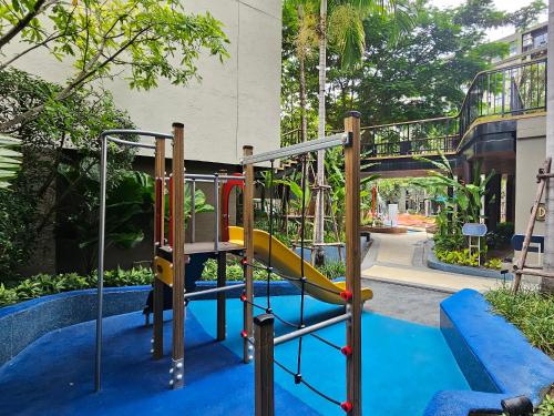 a playground in a park with a slide at La Habana HuaHin by ABCD in Hua Hin