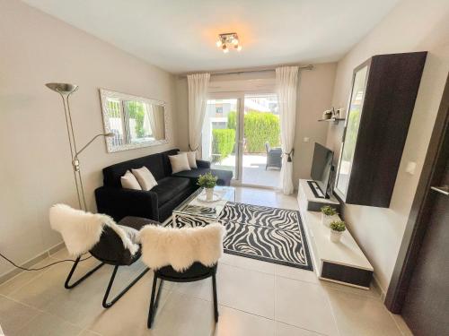 a living room with a couch and a table at Nova Beach Apartment 41 in Gran Alacant