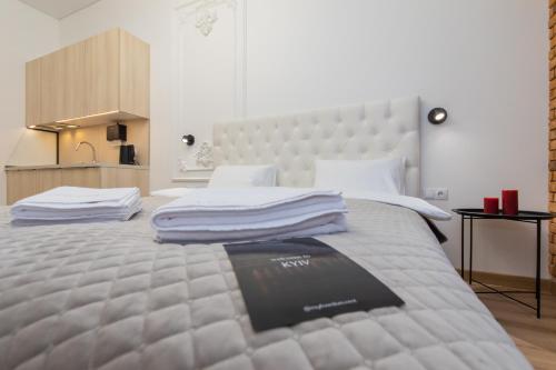 a bedroom with a large bed with a large headboard at LUX Апартаменти MYFREEDOM поруч метро Театральна, Хрещатик in Kyiv