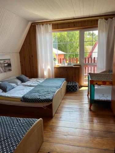 Postel nebo postele na pokoji v ubytování Rowianka