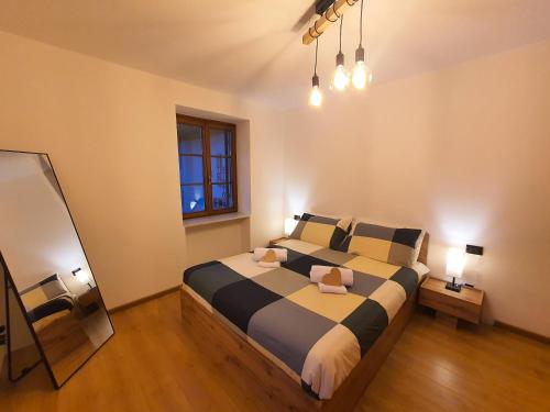 Postel nebo postele na pokoji v ubytování ElvesHome - Alpine Stay Apartments