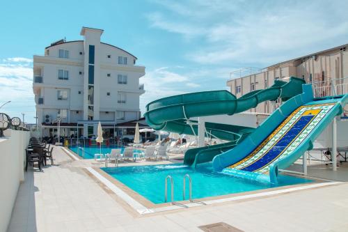 a slide in a pool on a cruise ship at Sarp Hotel Kadriye in Belek