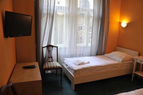 En eller flere senger på et rom på Hotelové Pokoje Kolčavka