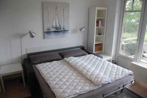 Großer Haffblick tesisinde bir odada yatak veya yataklar