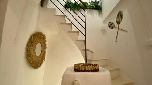 a stairway with a mirror and a toilet in a room at L'annexe spa du Tropical Lodge in Narbonne