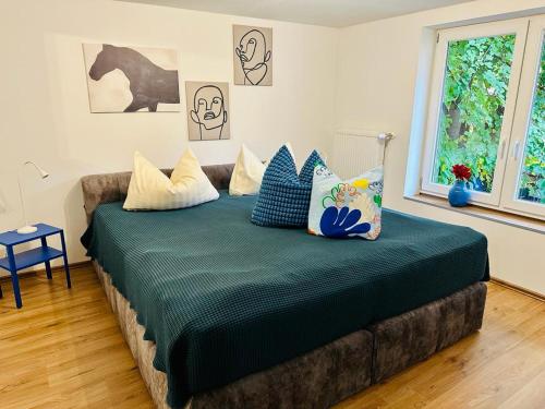 a bedroom with a large bed with pillows on it at Studio Reichenstrasse in Quedlinburg