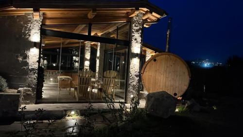 a house with a large wooden barrel in front of it at Villa Paladini in Montefiascone