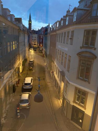 a view of a city street with cars parked at Central, Historical, Unique & Modern Apartment CPH in Copenhagen