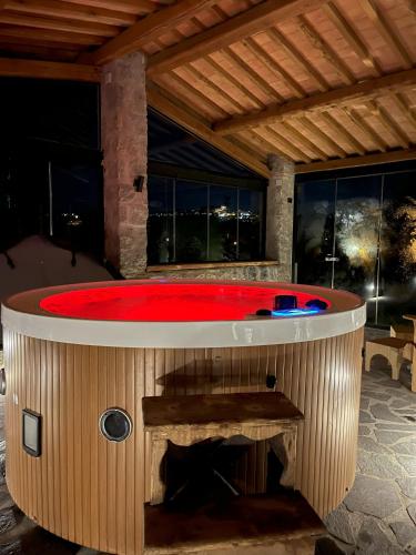 a large hot tub in a house with a red pool at Villa Paladini in Montefiascone