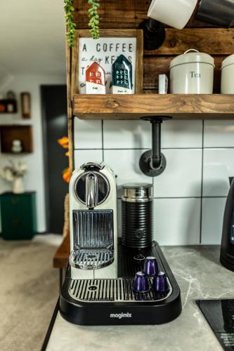 a coffee machine sitting on top of a counter at Modern 2-Bedroom Loft Apartment - Pendle Hill & Ribble Valley Views - Free Parking in Church