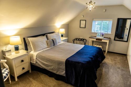 a bedroom with a large bed and a fireplace at Loft apartment in Accrington Stunning Lancashire views in Church