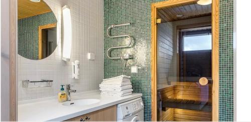 a bathroom with a sink and a shower at Enjoy MTB downhill and XC, hiking and SPA in Åre 29th July to 5th Aug at Holiday Club in Åre