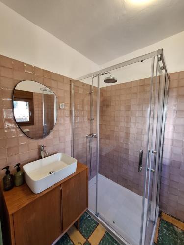 a bathroom with a sink and a shower at Casa rural El Moral by Fuentelgato in Huerta del Marquesado