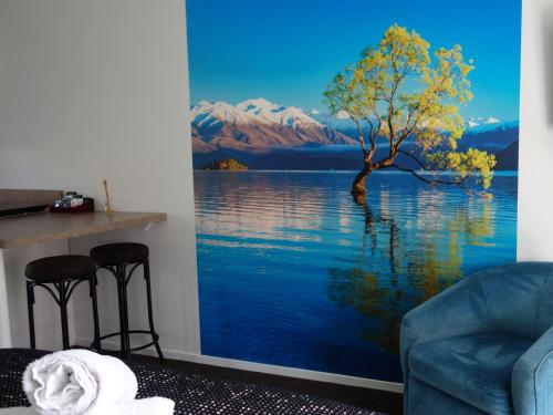 a tree on the water custom mural wallpaper at Northwood Motor Lodge in Christchurch