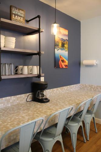 a bar with chairs and a table in a restaurant at Skylark Shores Resort in Lakeport